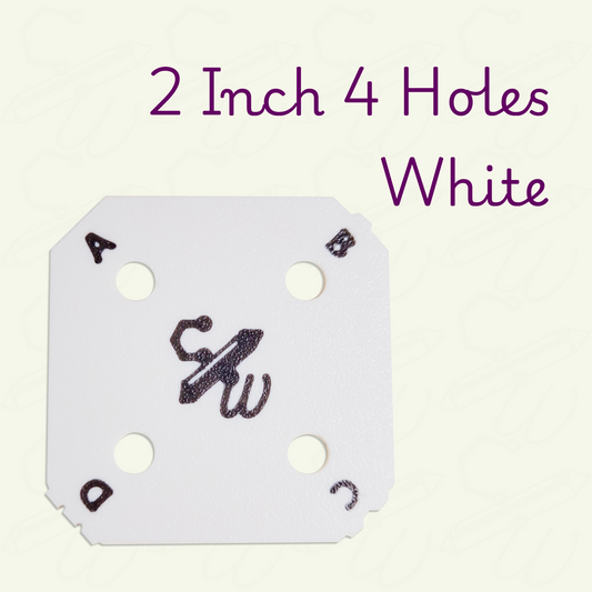 White 2 inch weaving card with 4 holes on a beige background. The weaving card has black letters A through D and corresponding bumps on each corner.