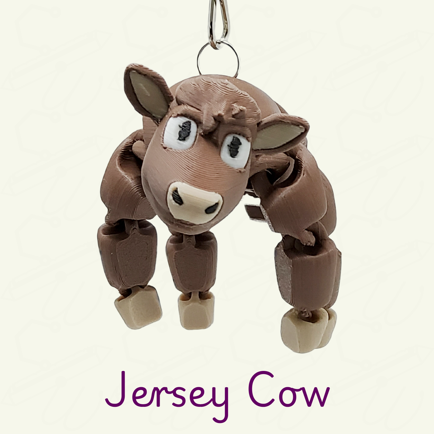 A Jersey cow keychian on a beige background with purple 'Jersey Cow' text.